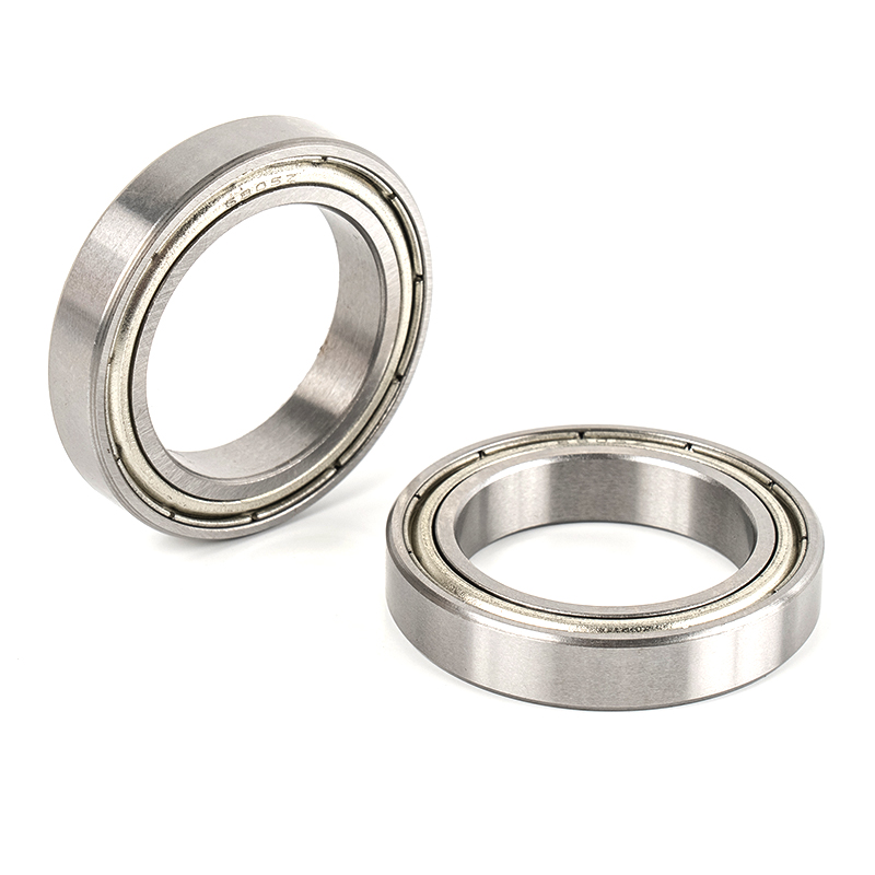 What does the axial displacement tolerance of deep groove ball bearings refer to?